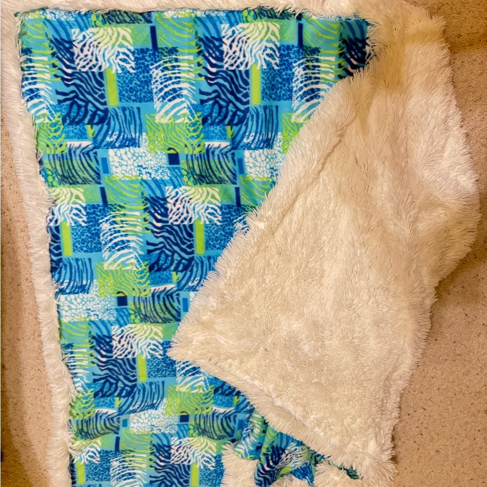 BRAND NEW Vibrant Blue and Green Patterned Throw Blanket that folds into pillow